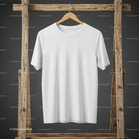 Plain white t shirt hanging on rustic wooden rack