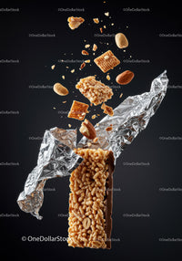 Crispy granola bar with nuts bursting out of wrapper
