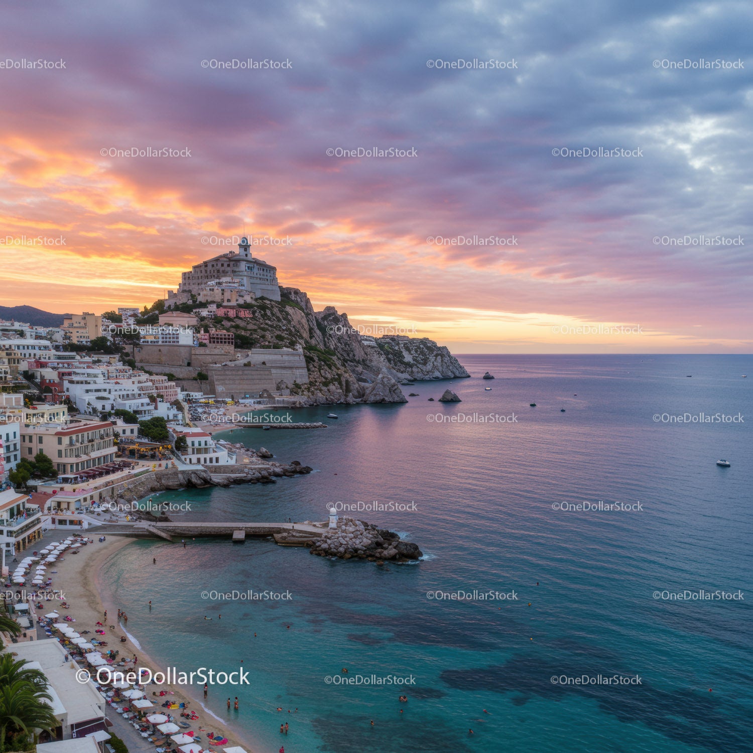Scenic Coastal Village with Sunset Over Rocky Cliffs and Calm Ocean