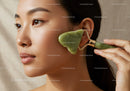 Close-Up of Woman Using Jade Roller for Facial Massage and Skin Rejuvenation