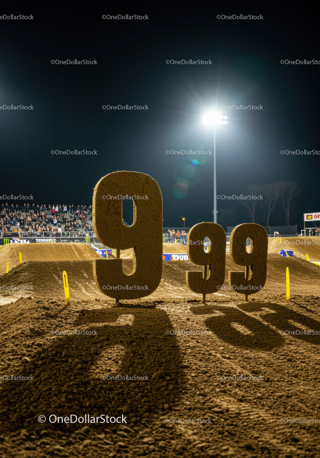 Number 99 signs on motocross dirt track at night