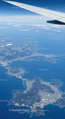 Aerial View of Coastal Islands and Ocean from Airplane Window