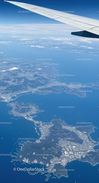 Aerial View of Coastal Islands and Ocean from Airplane Window