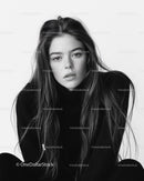 Elegant Black and White Portrait of Young Woman with Wavy Hair