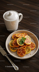 Dried Citrus Slices with Mint on Ceramic Plate