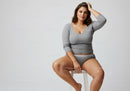 Casual Fashion Portrait of a Confident Woman Sitting on a Stool