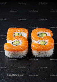 Fresh salmon sushi rolls with cucumber slice filling