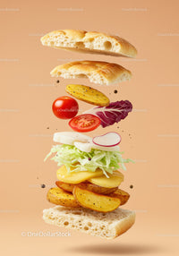 Fresh vegetarian sandwich ingredients floating on beige background