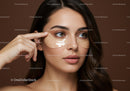 Young Woman Applying Under-Eye Gel for Brightening and Hydration