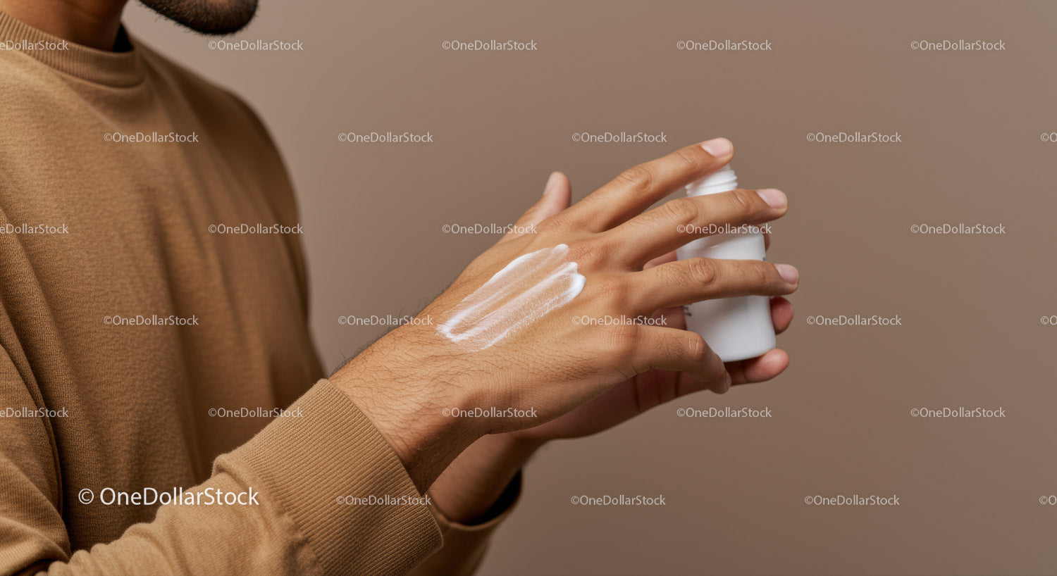 Man's Hand Applying Lotion for Skin Care and Moisturizing