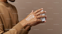 Man's Hand Applying Lotion for Skin Care and Moisturizing