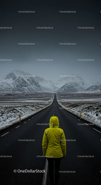Lonely Traveler in Yellow Jacket on Snow-Covered Road