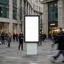 Blank digital billboard on busy urban pedestrian street