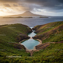 Scenic Coastal Landscape with Green Hills and Volcanic Mountain