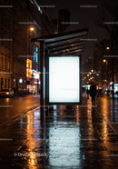 Night City Street with Illuminated Bus Stop and Neon Signs