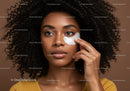 Portrait of a Woman Applying Facial Eye Patch with Natural Makeup