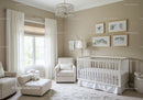 Bright Nursery Room with White Baby Crib and Elegant Botanical Artwork
