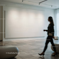 Woman walking past large blank canvas in modern gallery