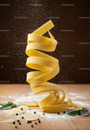 Twisting uncooked pasta ribbons with flour dust