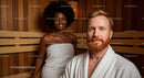 Happy Couple Relaxing in Sauna with Wooden Interior During Wellness Session