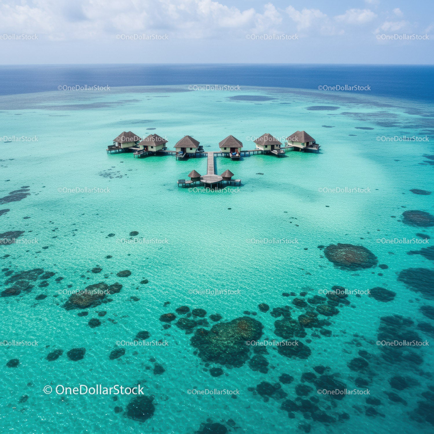 Overwater Bungalows on a Tropical Island with Clear Turquoise Water