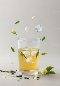 Refreshing iced tea with jasmine flowers and green leaves
