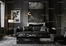 Modern dark living room with leather sofa and marble fireplace