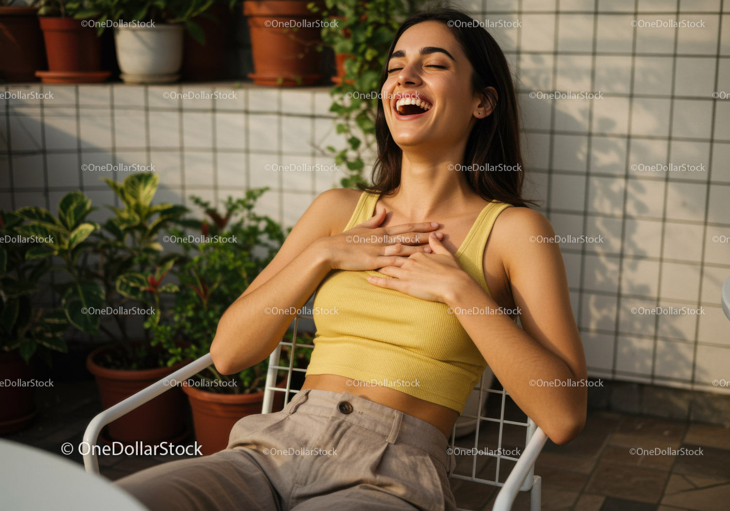 Joyful Woman Laughing Outdoors in Bright Terrace with Green Plants