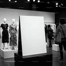 Modern boutique interior with blank display board