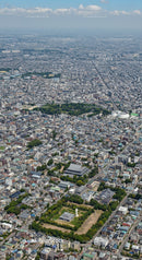 Aerial View of a Dense Urban City with Parks and Skyscrapers