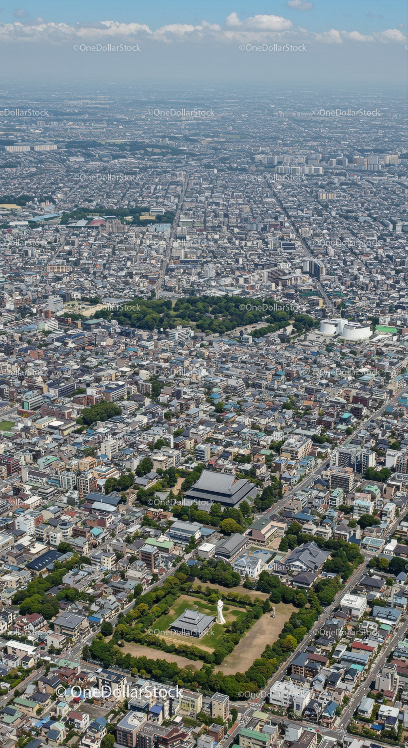 Aerial View of a Dense Urban City with Parks and Skyscrapers