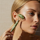 Close-up of a Woman Using Jade Roller for Facial Skincare