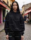 Fashionable Woman Wearing Black Hoodie in Urban City Street