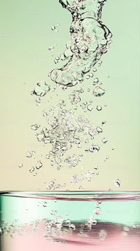 Close-up of Bubbles and Splash in Clear Water