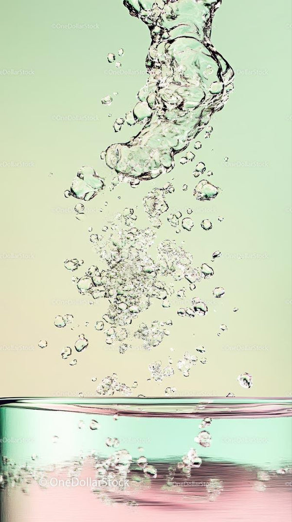 Close-up of Bubbles and Splash in Clear Water