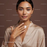 Portrait of a Woman Applying Facial Cream with Glowing Skin