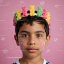 Child Wearing Colorful Gummy Bear Crown with Face Paint