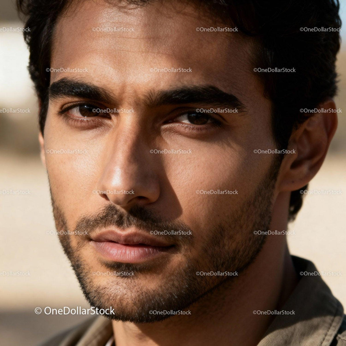 Close up portrait of thoughtful young man outdoors
