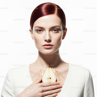 Elegant Woman with Pear and Red Hair in Studio Portrait