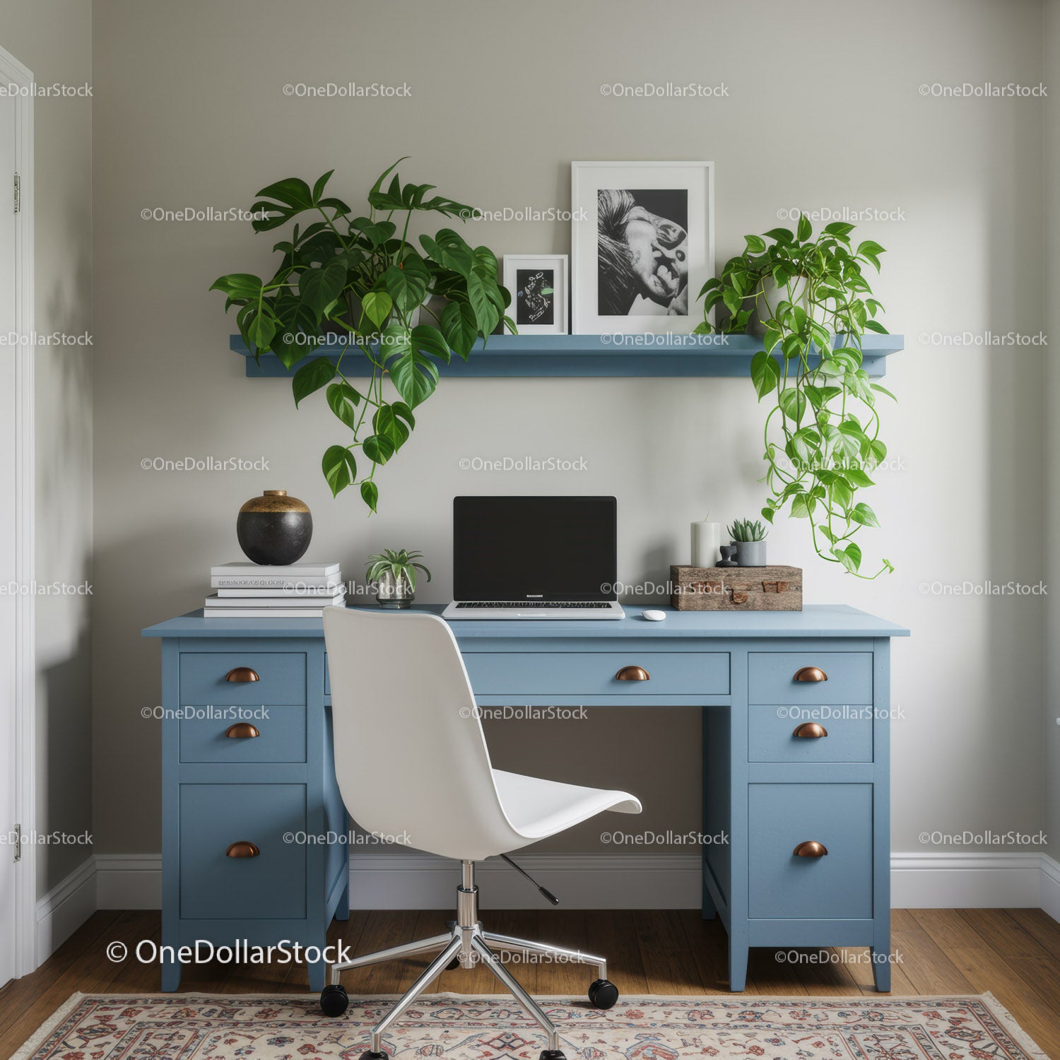 Modern Blue Desk with Green Houseplants and Artistic Decor in Cozy Interior