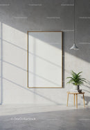 Minimalist room with blank frame and green plant decor