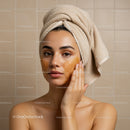 Young Woman Applying Facial Mask for Skincare Treatment