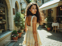 Young Woman in Summer Dress Walking Outdoors in Bright Sunny Day