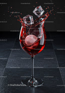 Red cocktail splashing with ice cubes in wine glass