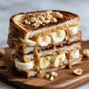Banana and Peanut Butter Toast with Nuts on Wooden Board