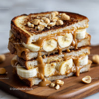Banana and Peanut Butter Toast with Nuts on Wooden Board