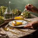 Elegant Lemon Tart Slice on Fine China with Gold Cutlery and Floral Decor