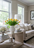 Bright Living Room with Yellow Tulips and Cozy White Sofa