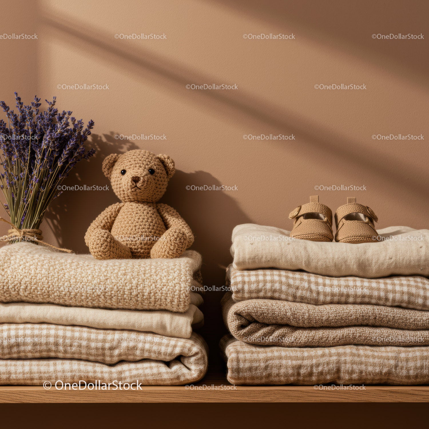 Cozy neutral baby clothes with soft toy and lavender