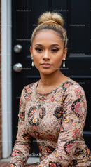 Confident young woman with elegant floral dress outdoors